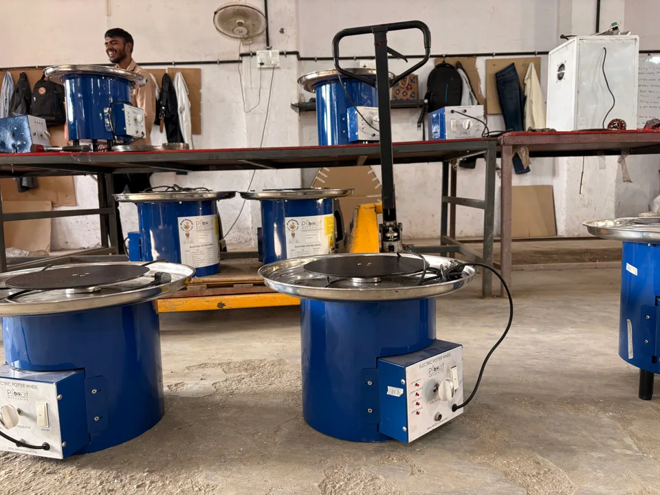 Source LinkedIn photograph showing equipment and a pallet truck in a manufacturing work area.